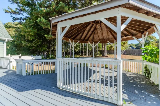 a view of a kitchen with a sink and a ceiling fan