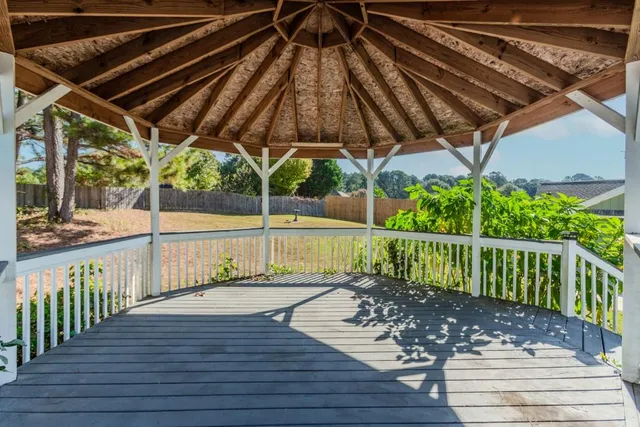 an empty room with a empty space and windows