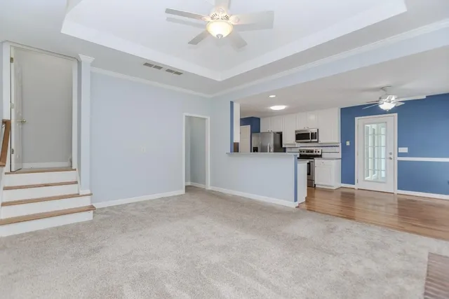 a view of an empty room with a cabinet