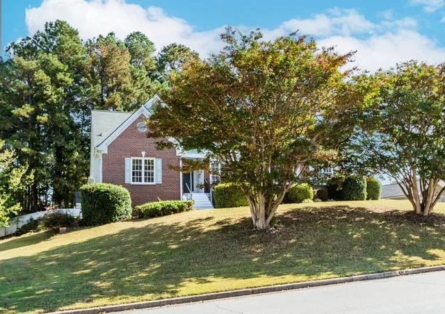 a view of a backyard of the house
