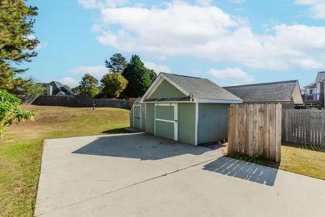 a kitchen with a refrigerator stove and wooden floor