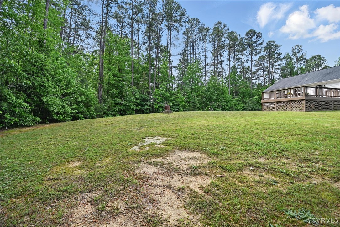 14609 Gatewood Road Dewitt, VA 23840 - Photo 24 of 25 View of grassy yard with a deck