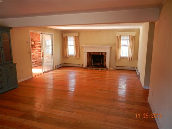 78 Alley Road Rochester, MA 02770 - Photo 4 of 11 a view of an empty room with wooden floor and a window