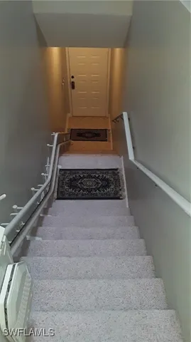 a view of a street with cars parked