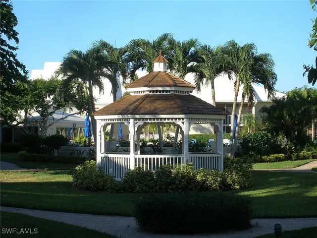 a view of a swimming pool with sitting area