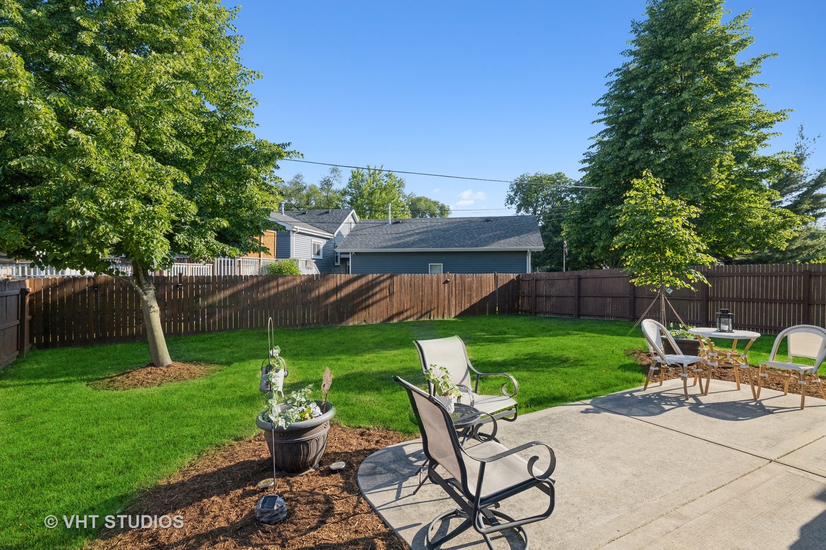 2267 Caton Farm Road Crest Hill, IL 60403 - Photo 20 of 21 a view of a chair and table in backyard of the house