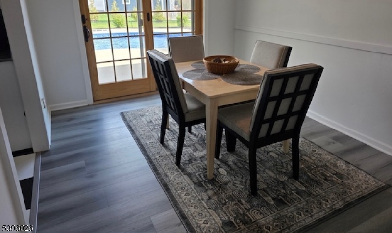 4435 Rudetown Road Hamburg, NJ 07419 - Photo 9 of 24 a view of a dining room with furniture and wooden floor