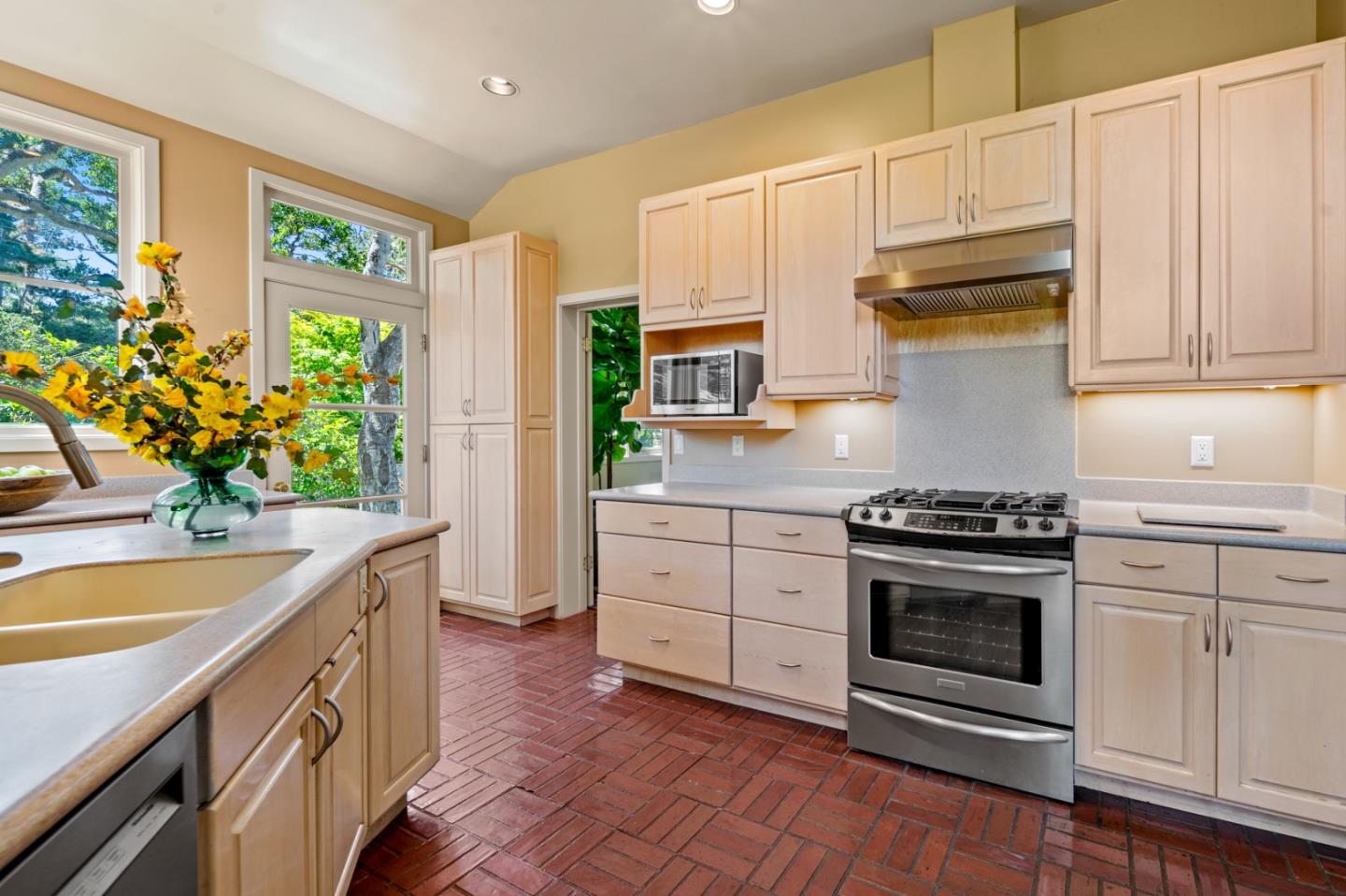 0 Junipero Carmel, CA 93923 - Photo 16 of 42 a kitchen with stainless steel appliances white cabinets and a stove top oven