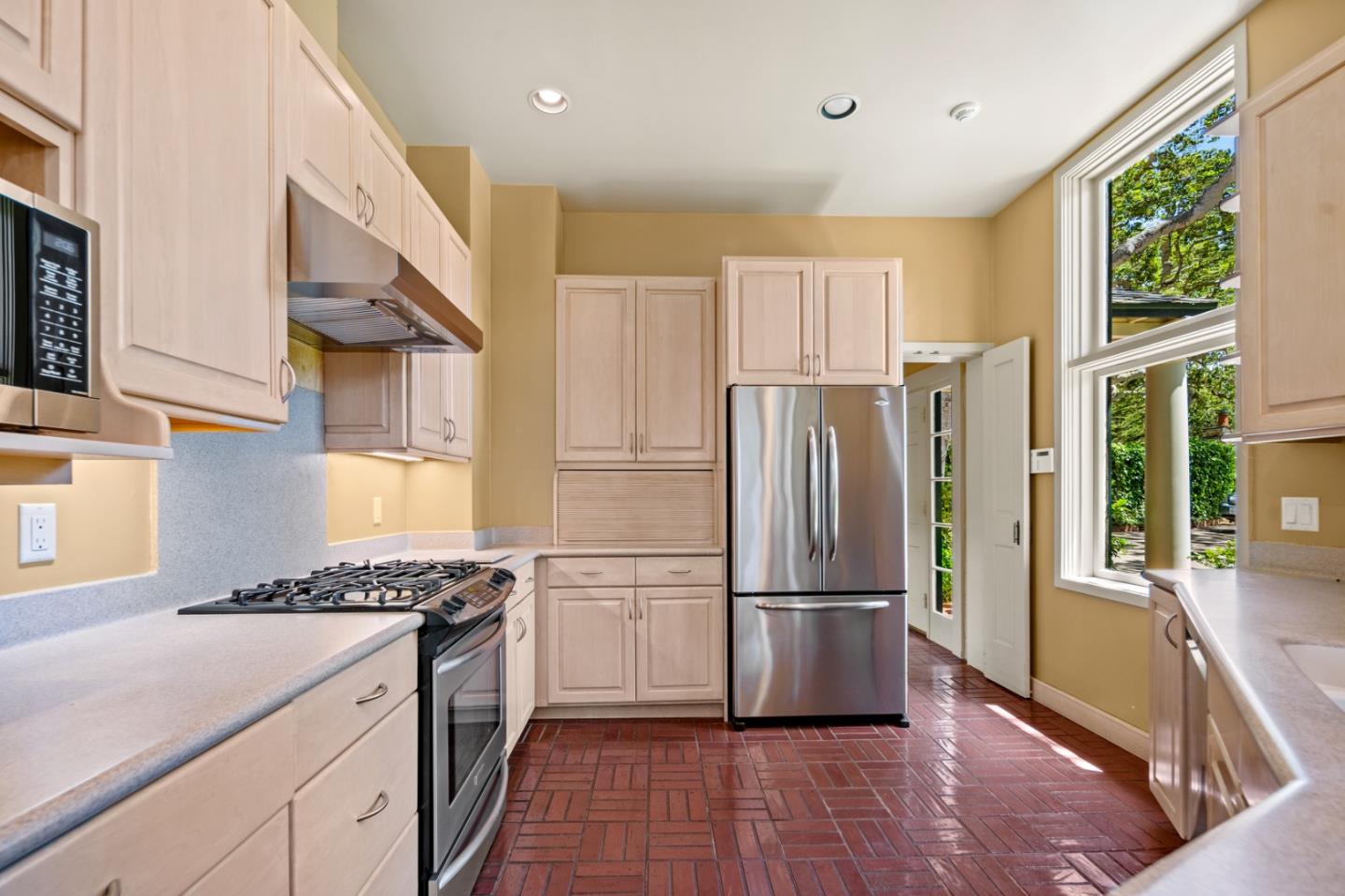 0 Junipero Carmel, CA 93923 - Photo 17 of 42 a kitchen with granite countertop stainless steel appliances a refrigerator microwave and stove top oven