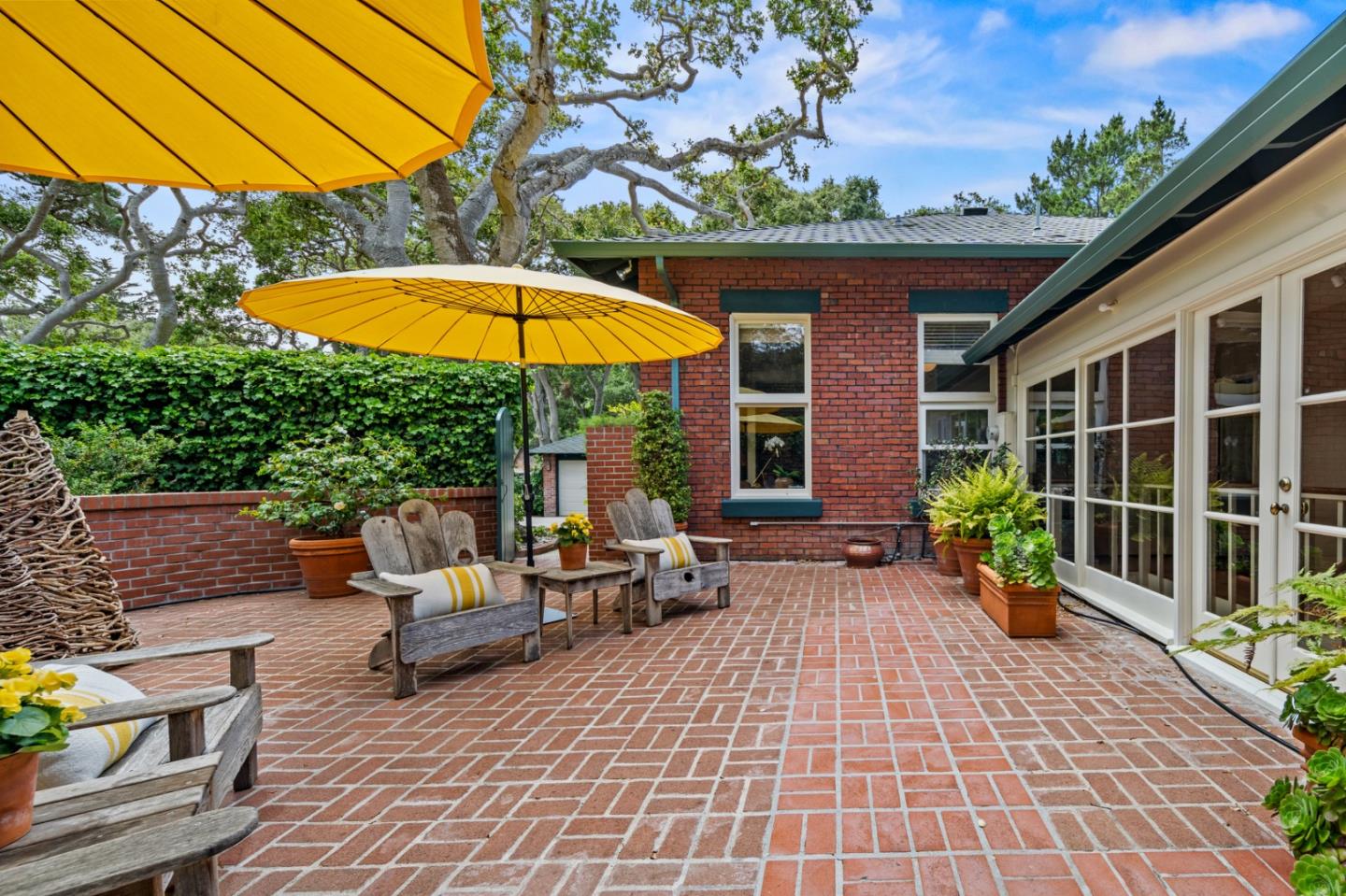 0 Junipero Carmel, CA 93923 - Photo 23 of 42 a view of a patio with a table and chairs under an umbrella