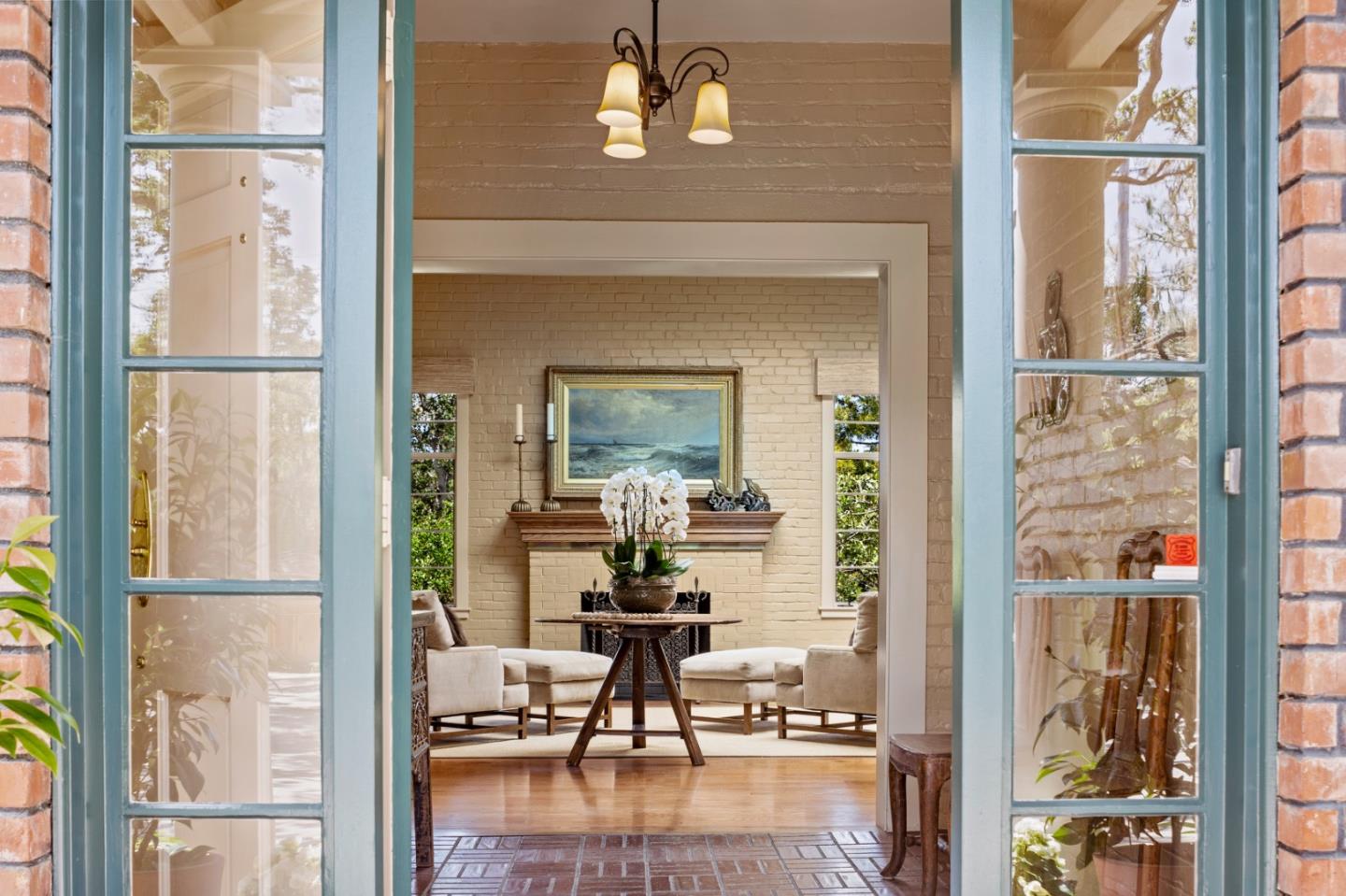 0 Junipero Carmel, CA 93923 - Photo 3 of 42 a living room with a table chairs and a chandelier