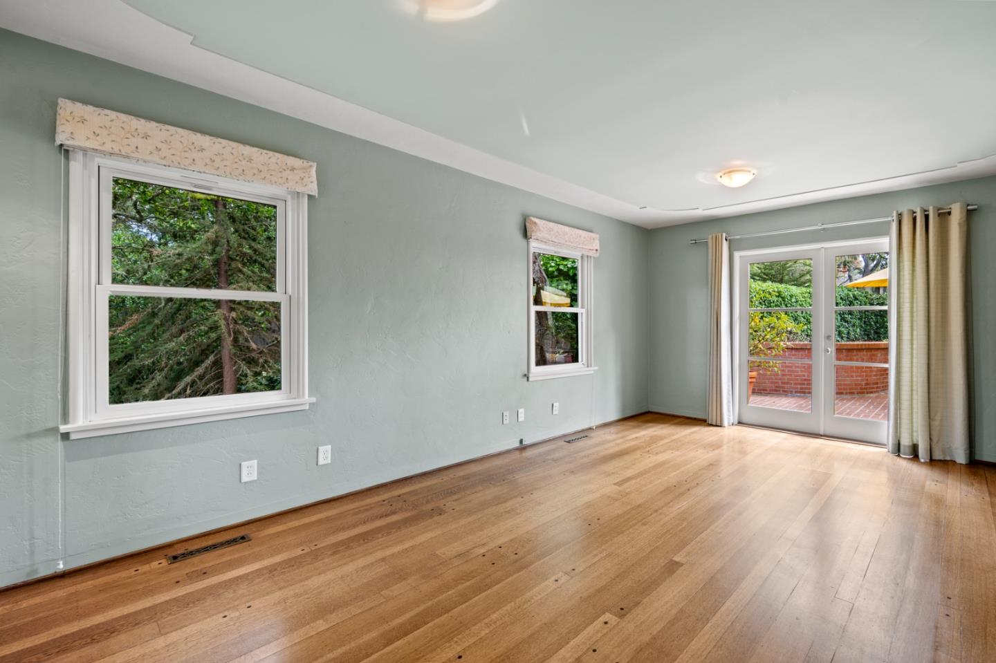 0 Junipero Carmel, CA 93923 - Photo 32 of 42 a view of an empty room with wooden floor and a window