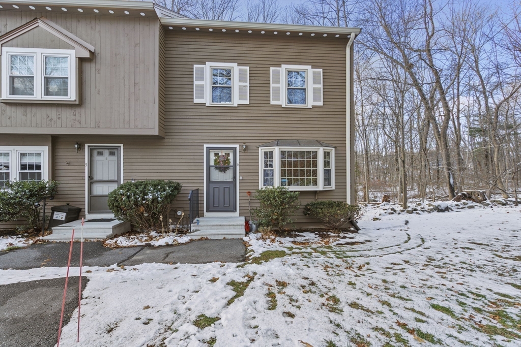 4 Apple Ridge Road, Unit 6 Maynard, MA 01754 - Photo 27 of 40 a front view of a house with a yard
