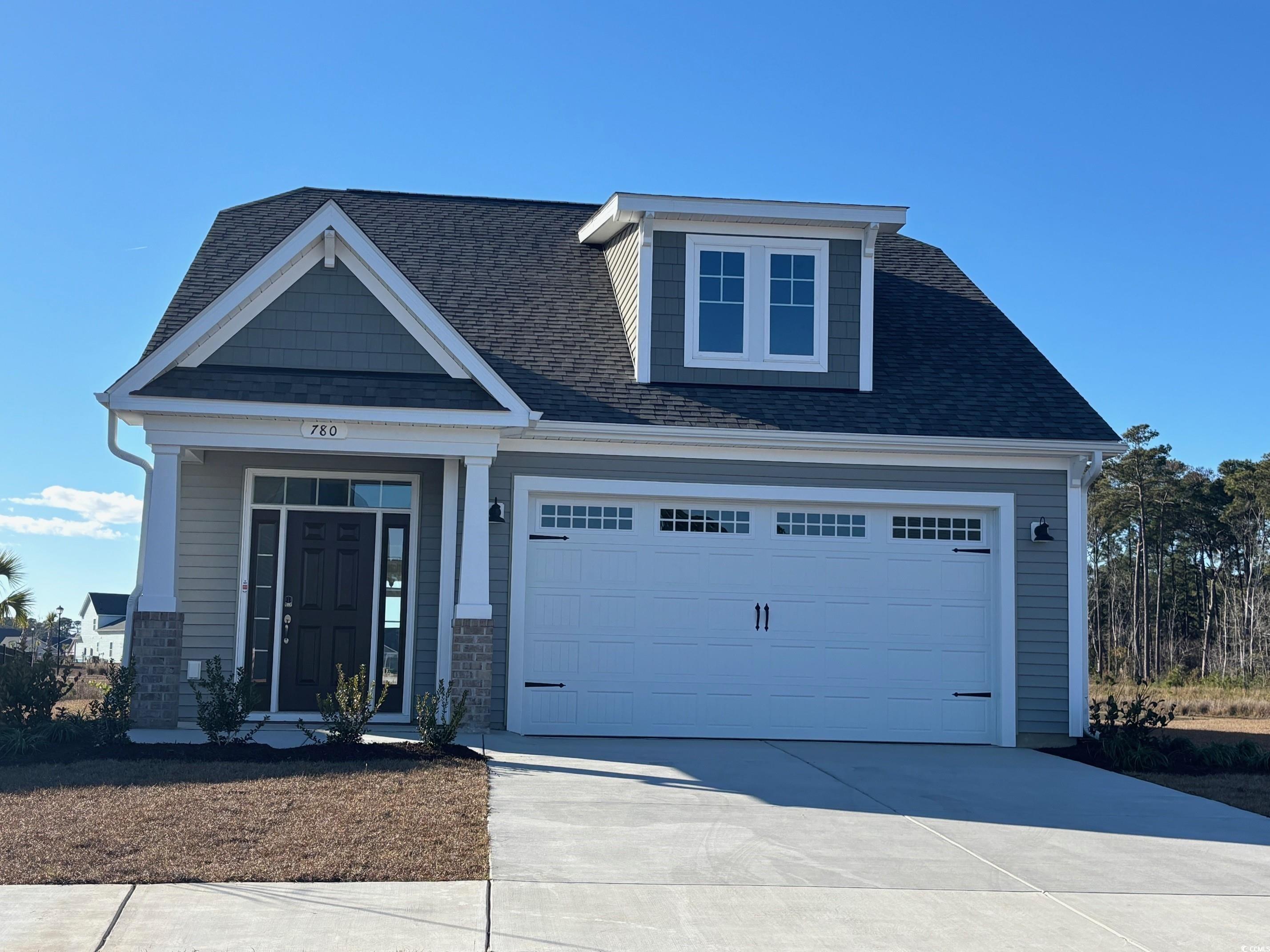 780 Cascade Loop Little River, SC 29566 - Photo 1 of 15 Craftsman-style house featuring a garage