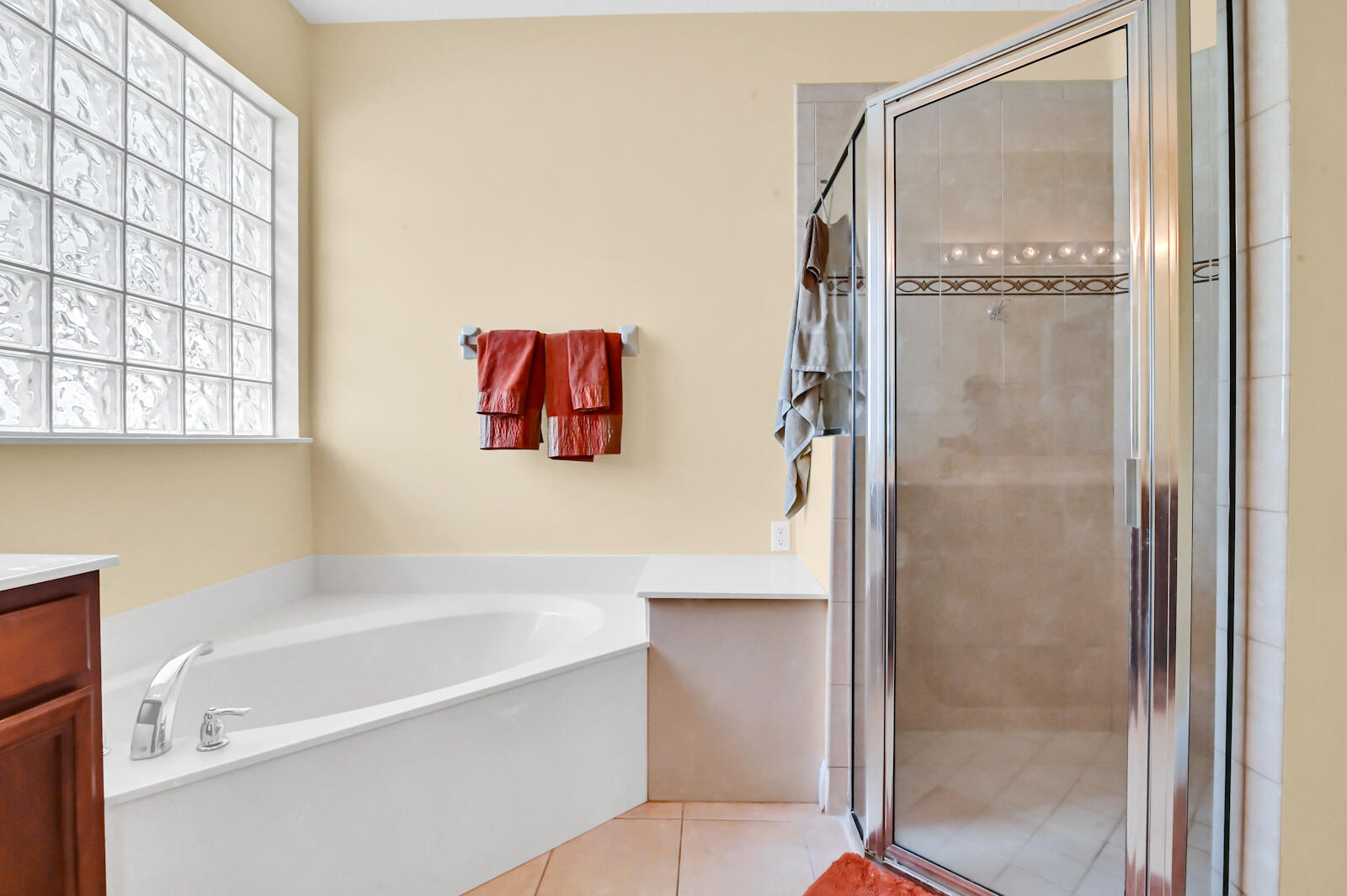244 Clocktower Drive Jupiter, FL 33458 - Photo 13 of 36 a bathroom with a bathtub and a shower