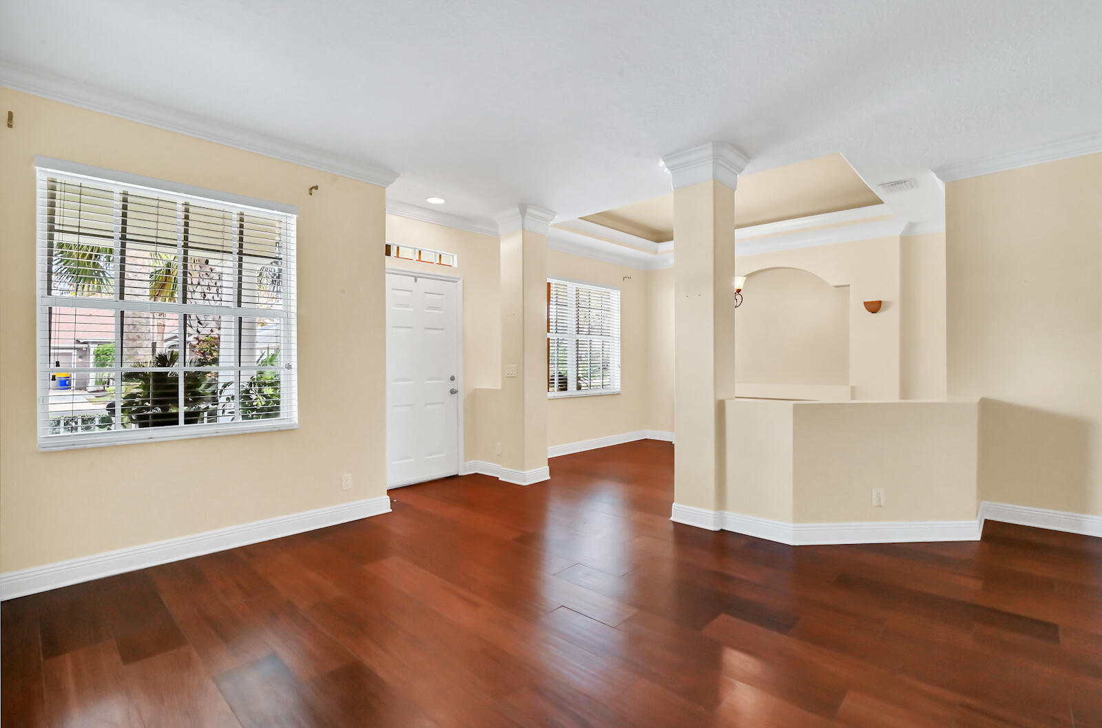244 Clocktower Drive Jupiter, FL 33458 - Photo 14 of 36 a view of an empty room with wooden floor and a window