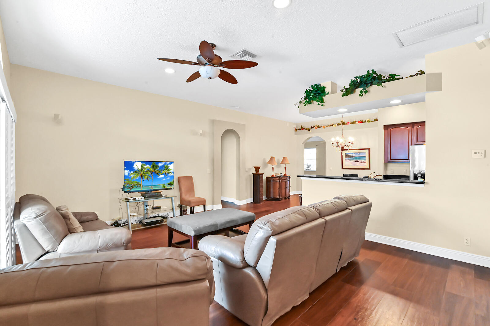 244 Clocktower Drive Jupiter, FL 33458 - Photo 20 of 36 a living room with furniture and a flat screen tv