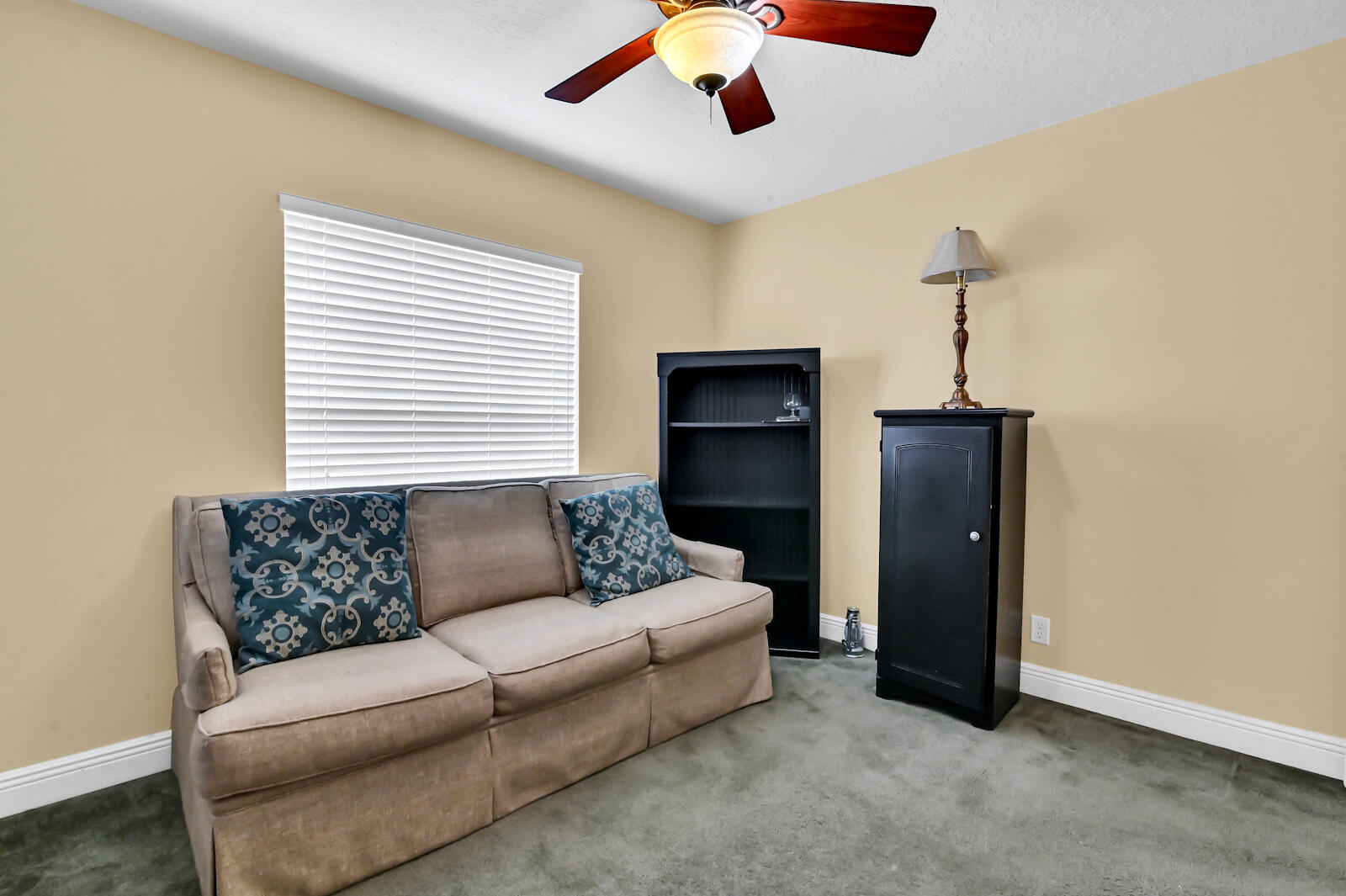 244 Clocktower Drive Jupiter, FL 33458 - Photo 27 of 36 a living room with furniture and a window