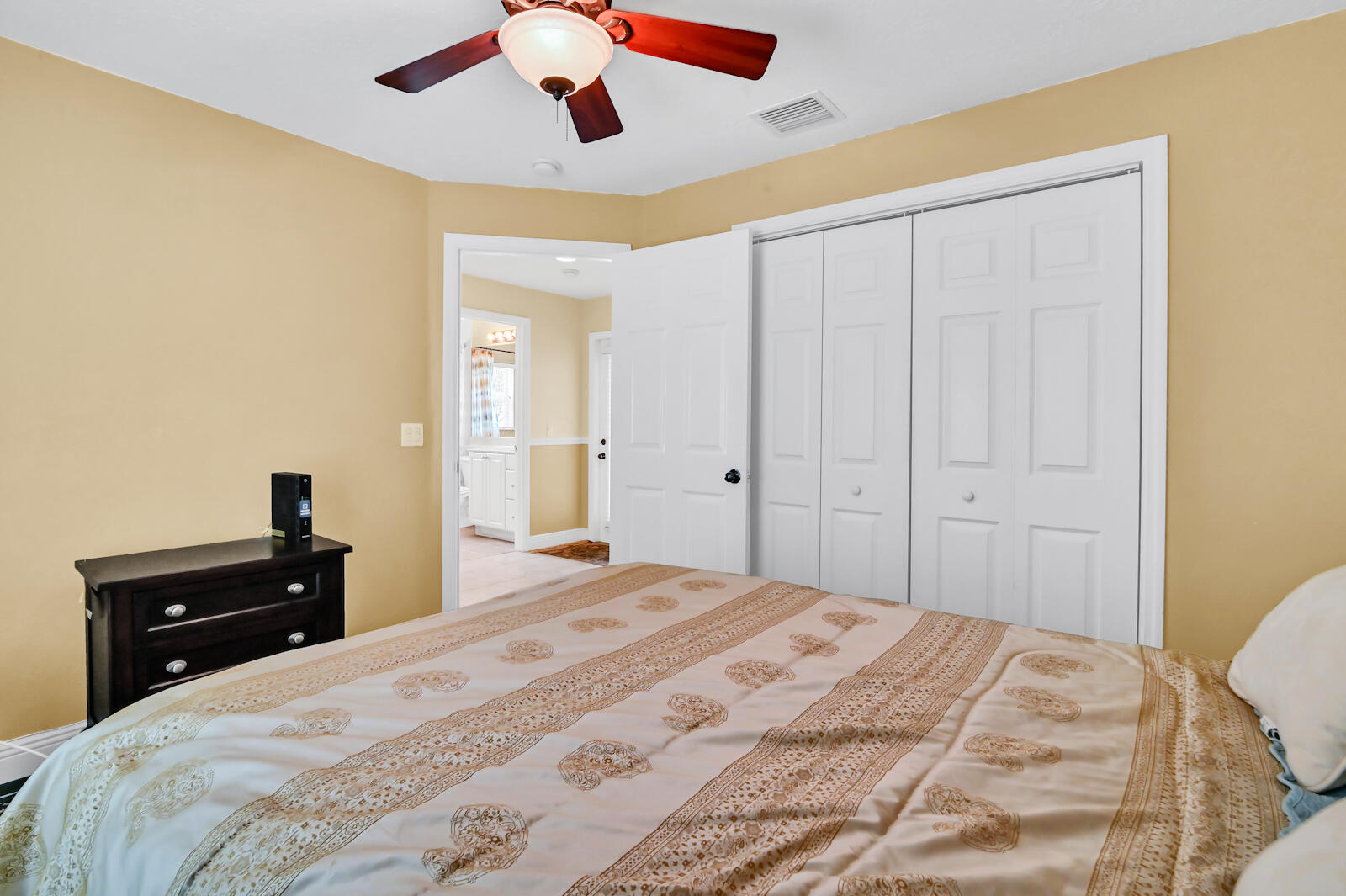 244 Clocktower Drive Jupiter, FL 33458 - Photo 29 of 36 a bedroom with a bed and a closet