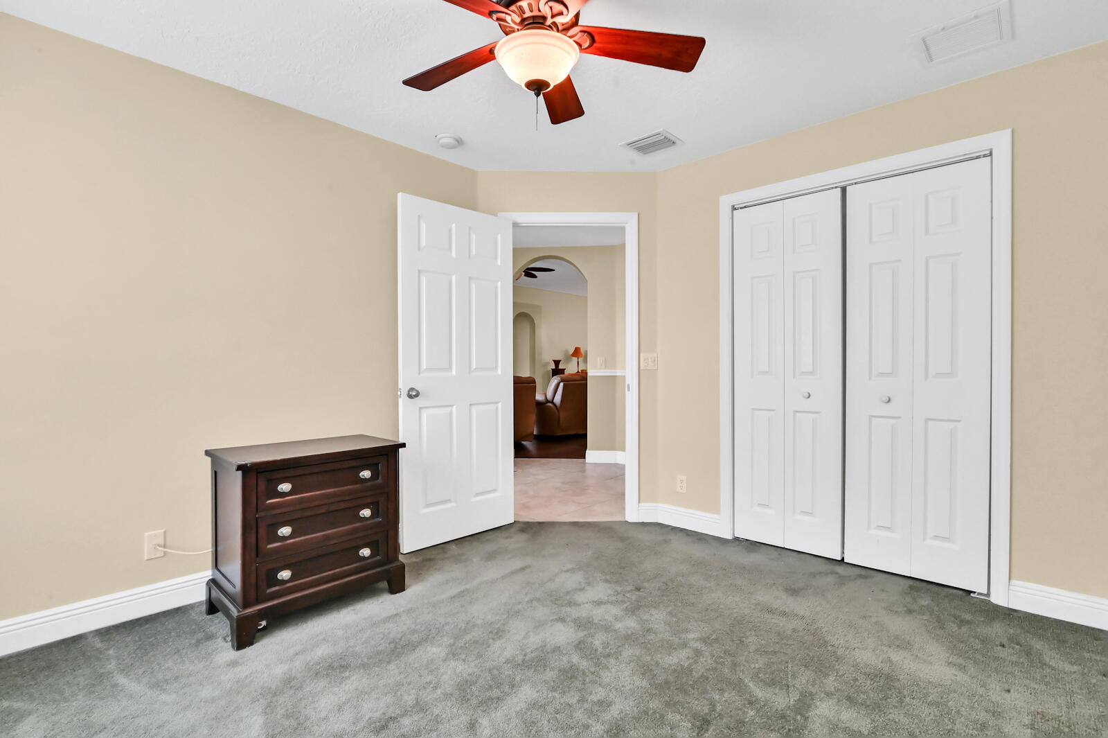 244 Clocktower Drive Jupiter, FL 33458 - Photo 31 of 36 a view of room with cabinet and a ceiling fan