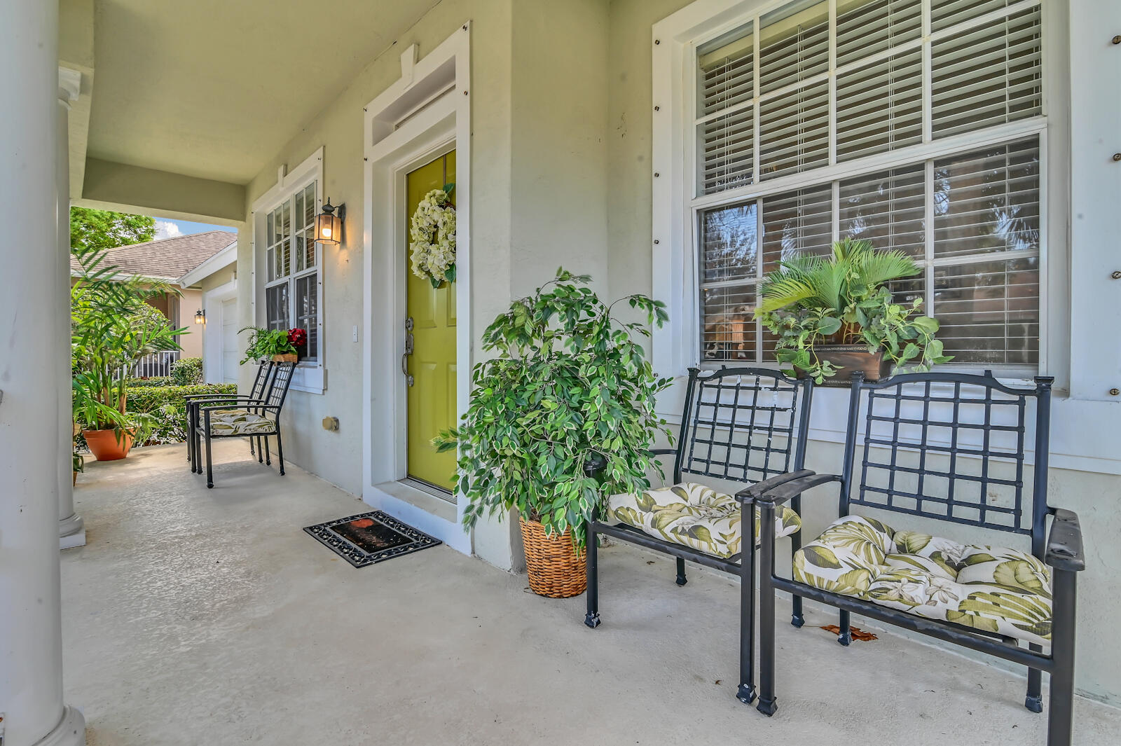 244 Clocktower Drive Jupiter, FL 33458 - Photo 5 of 36 a backyard of a house with barbeque oven table and chairs