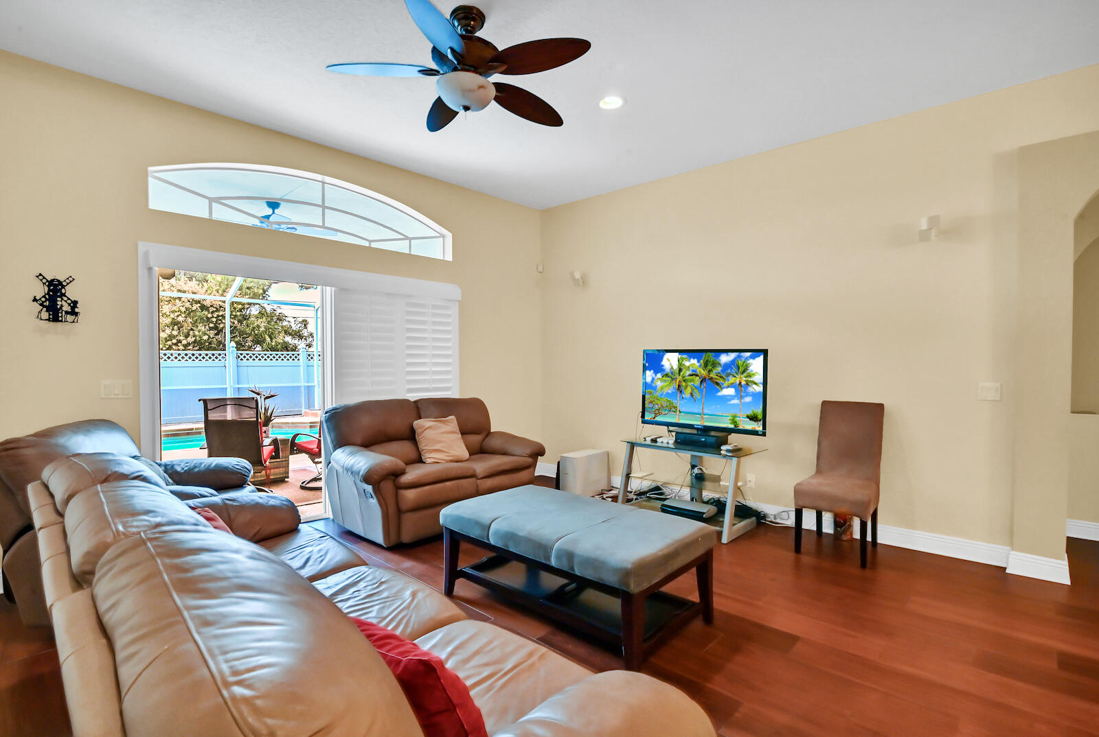 244 Clocktower Drive Jupiter, FL 33458 - Photo 10 of 36 a living room with furniture and a flat screen tv