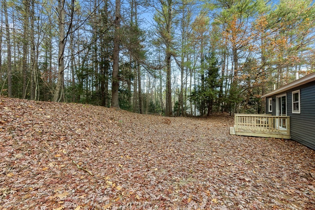 122 Townsend Road Shirley, MA 01464 - Photo 30 of 34 a wooden house with trees in front of it