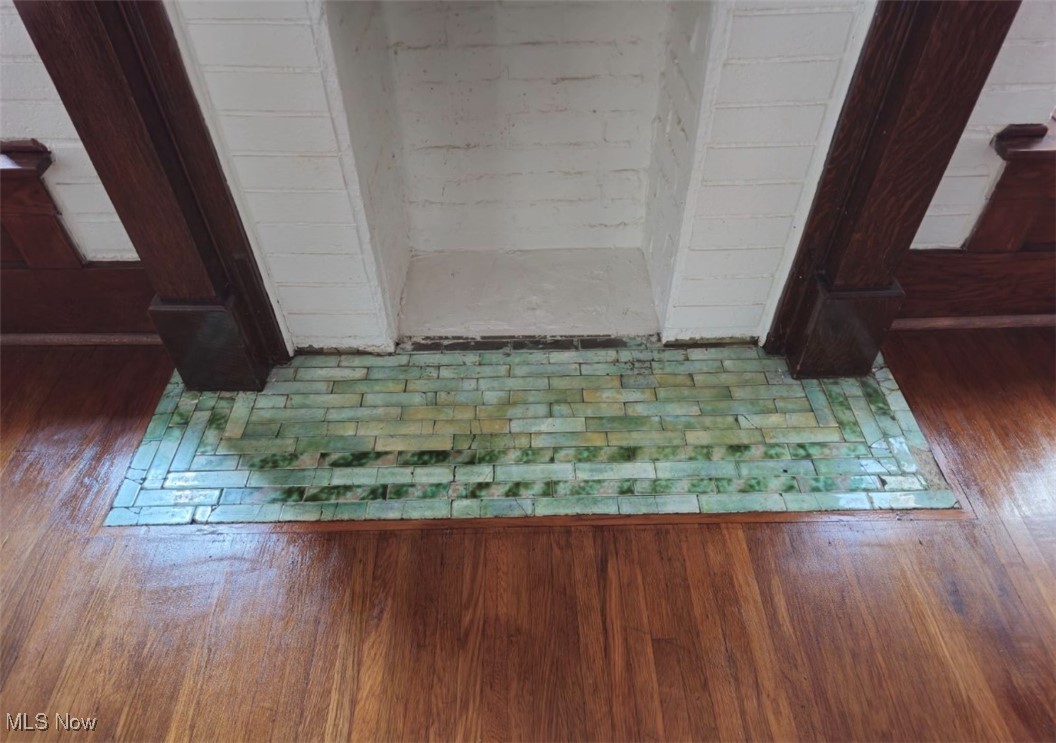 5123 Reed Avenue Ashtabula, OH 44004 - Photo 7 of 37 Fireplace with antique tile