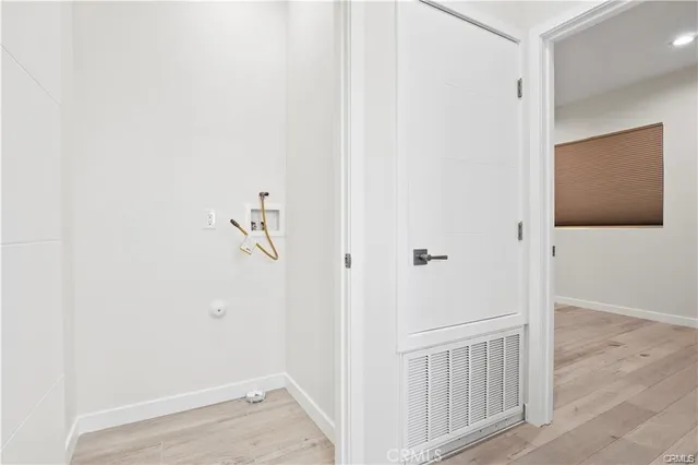 a view of a livingroom with wooden floor