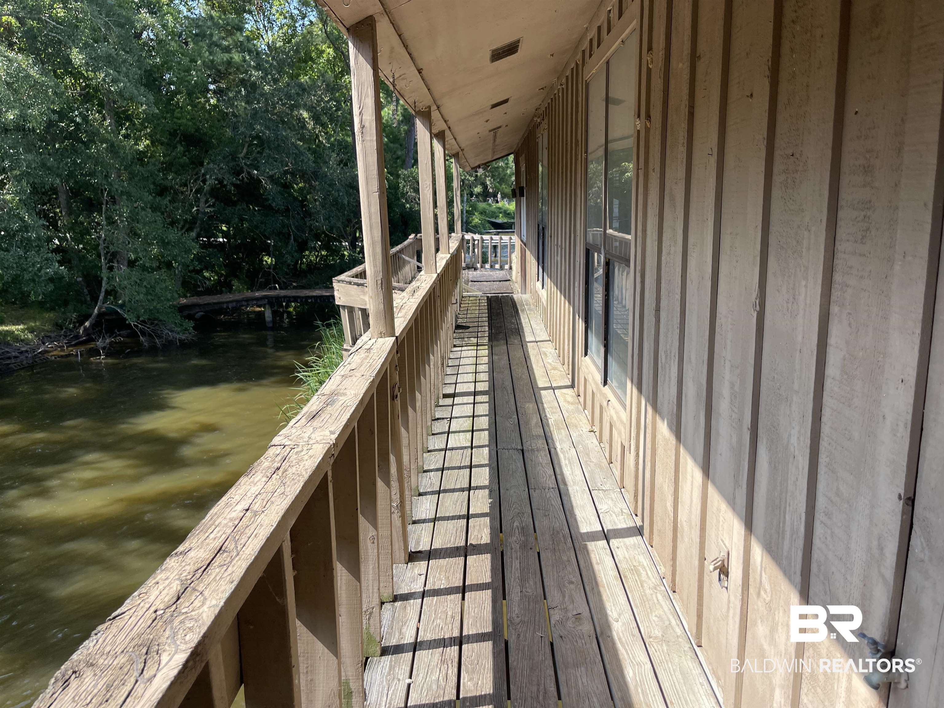 3074 Riverside Drive West Mobile, AL 36605 - Photo 4 of 15 Exterior space with a boat dock and a water view