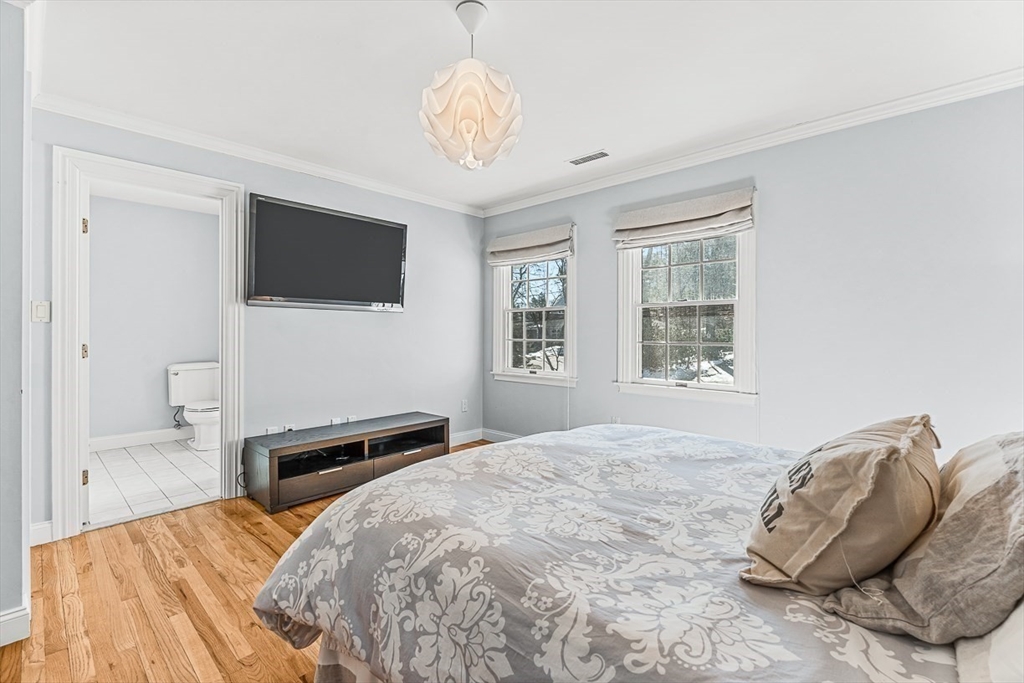 78 Byron Road Weston, MA 02493 - Photo 12 of 17 a bedroom with a bed and a flat screen tv