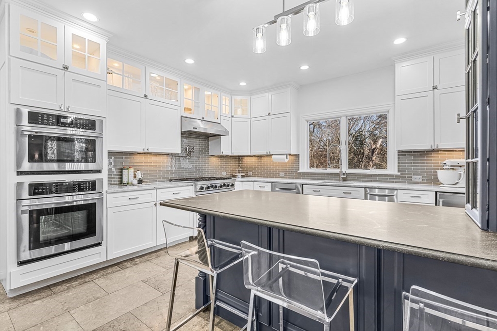 78 Byron Road Weston, MA 02493 - Photo 4 of 17 a kitchen with stainless steel appliances granite countertop a stove and a sink