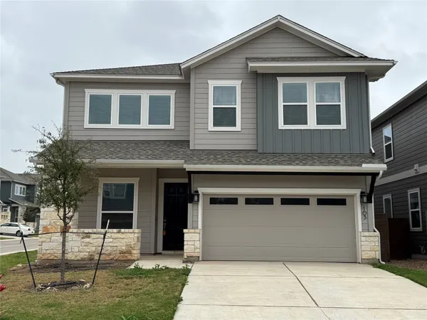 a front view of a house with a garage