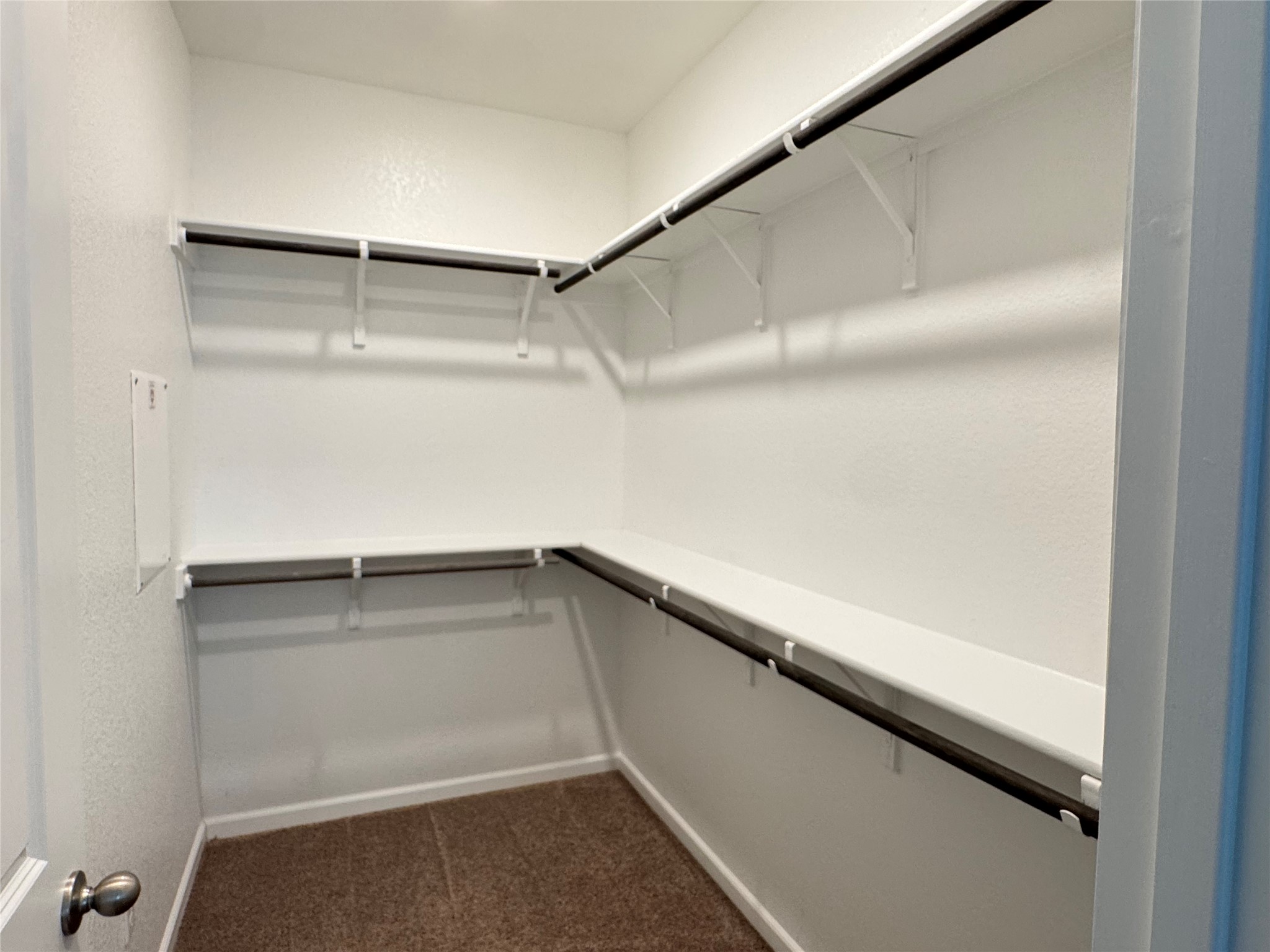 3000 Chisholm Trail Road, Unit 103 Round Rock, TX 78681 - Photo 14 of 32 Primary ClosetWalk in closet featuring dark carpet