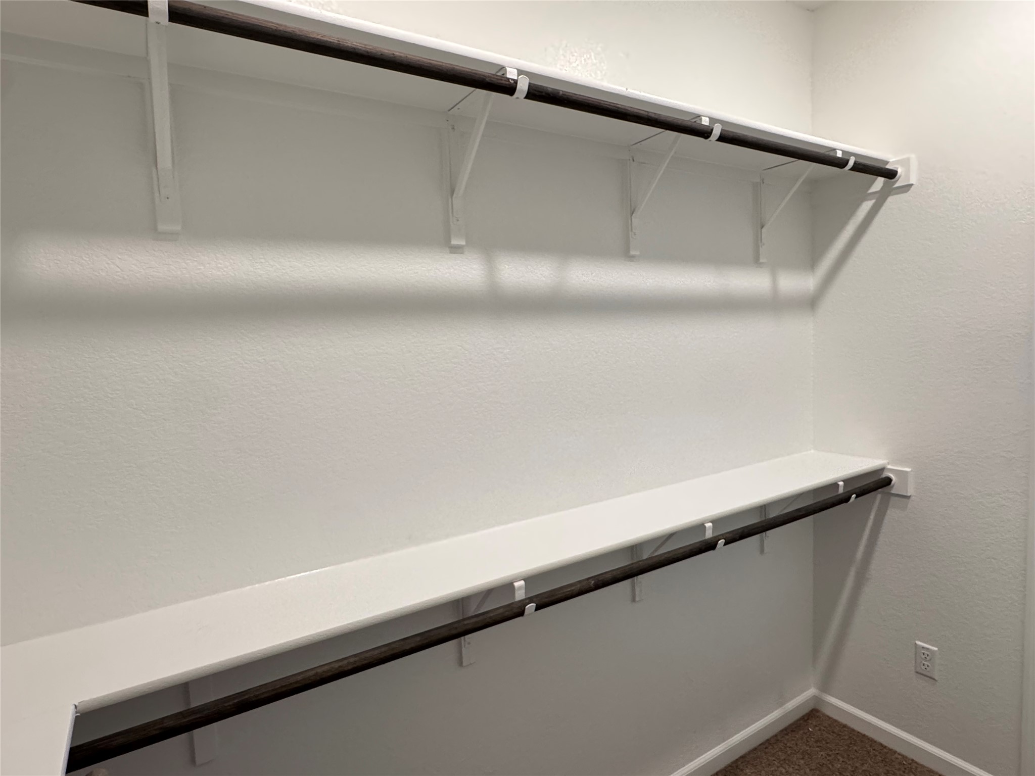 3000 Chisholm Trail Road, Unit 103 Round Rock, TX 78681 - Photo 15 of 32 Primary Closet Walk in closet with dark colored carpet