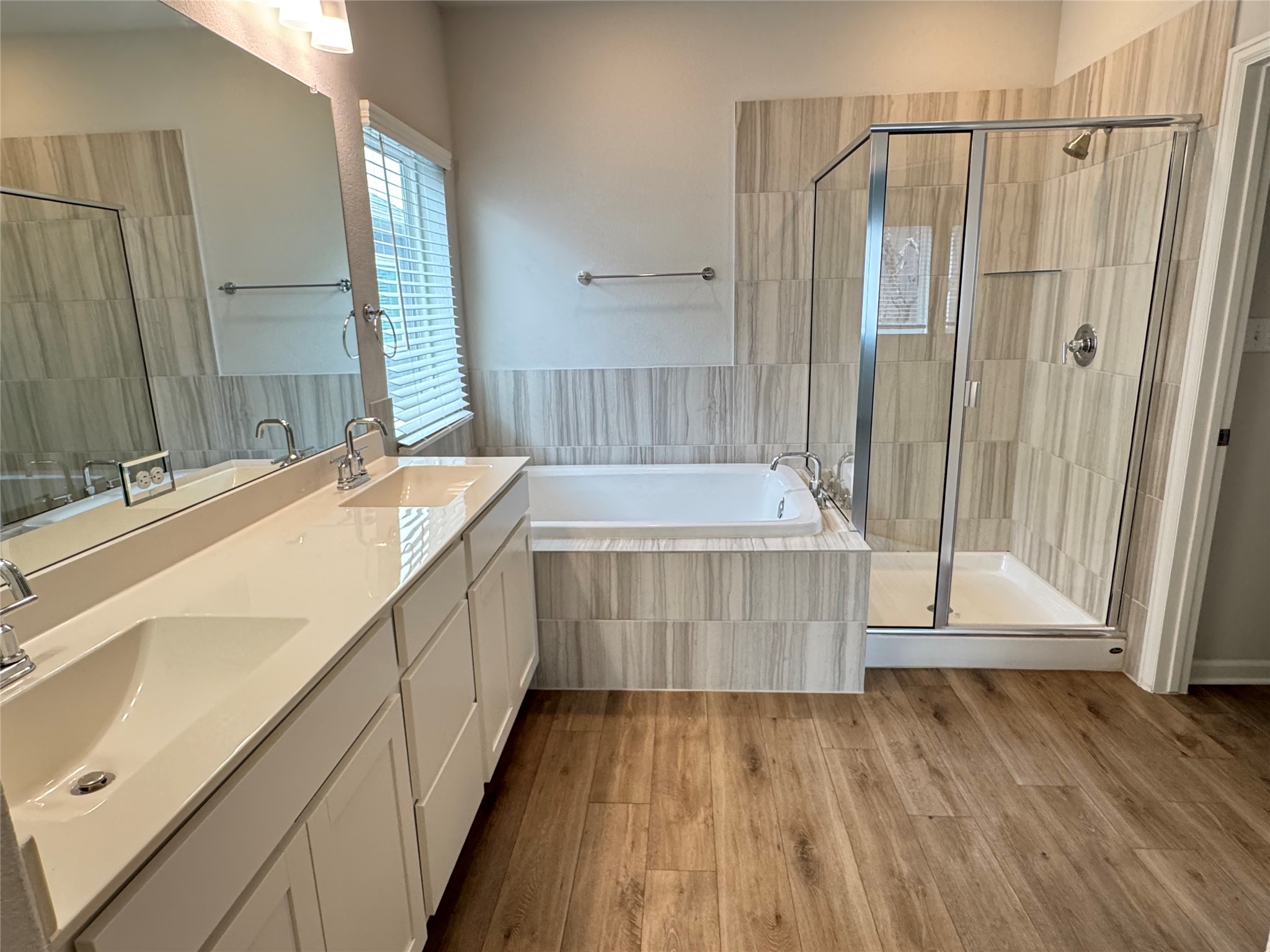 3000 Chisholm Trail Road, Unit 103 Round Rock, TX 78681 - Photo 16 of 32 a bathroom with a sink a mirror and a bathtub