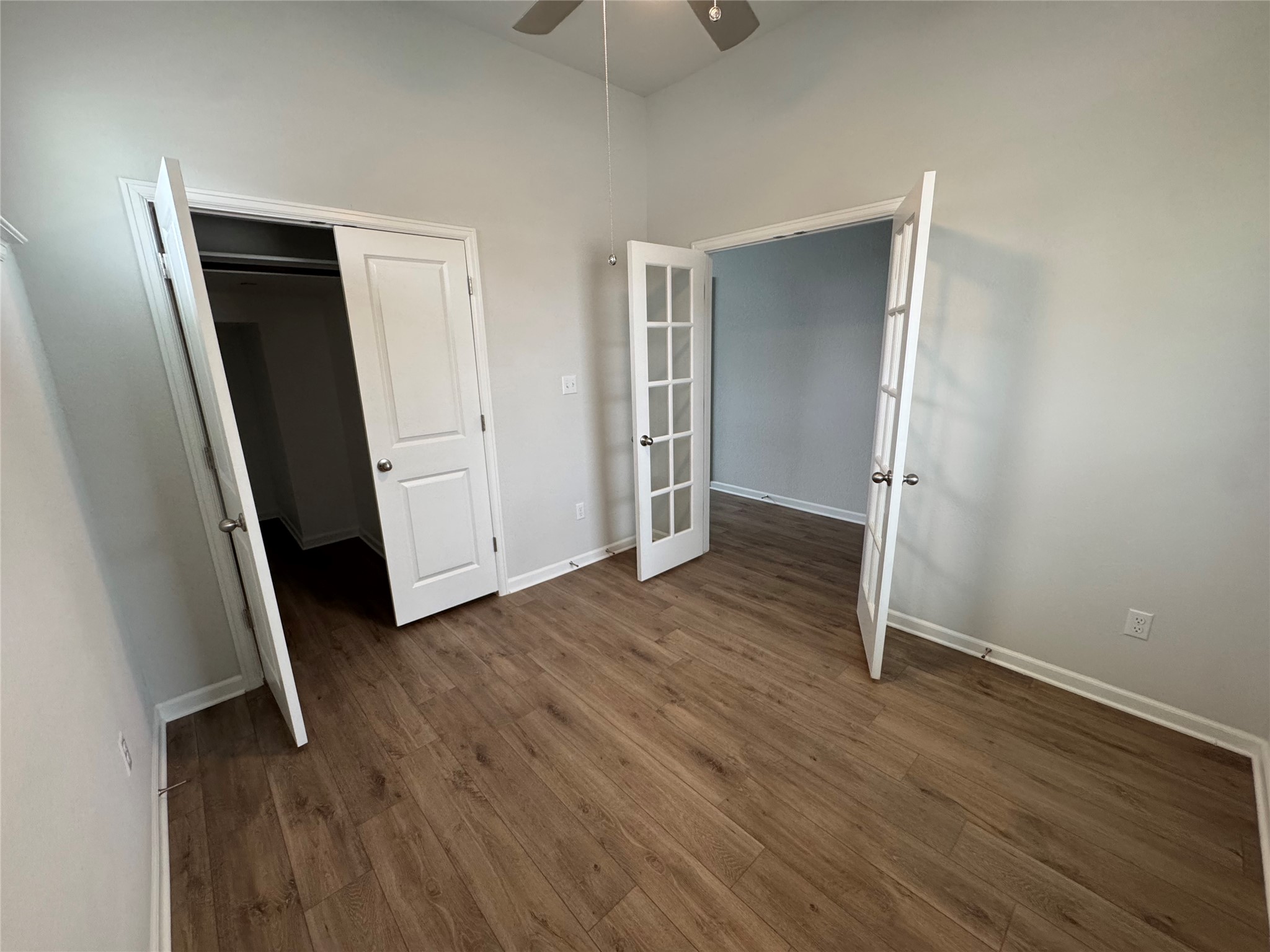 3000 Chisholm Trail Road, Unit 103 Round Rock, TX 78681 - Photo 2 of 32 an empty room with wooden floor and closet area