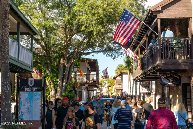 a bedroom with bed and a large window