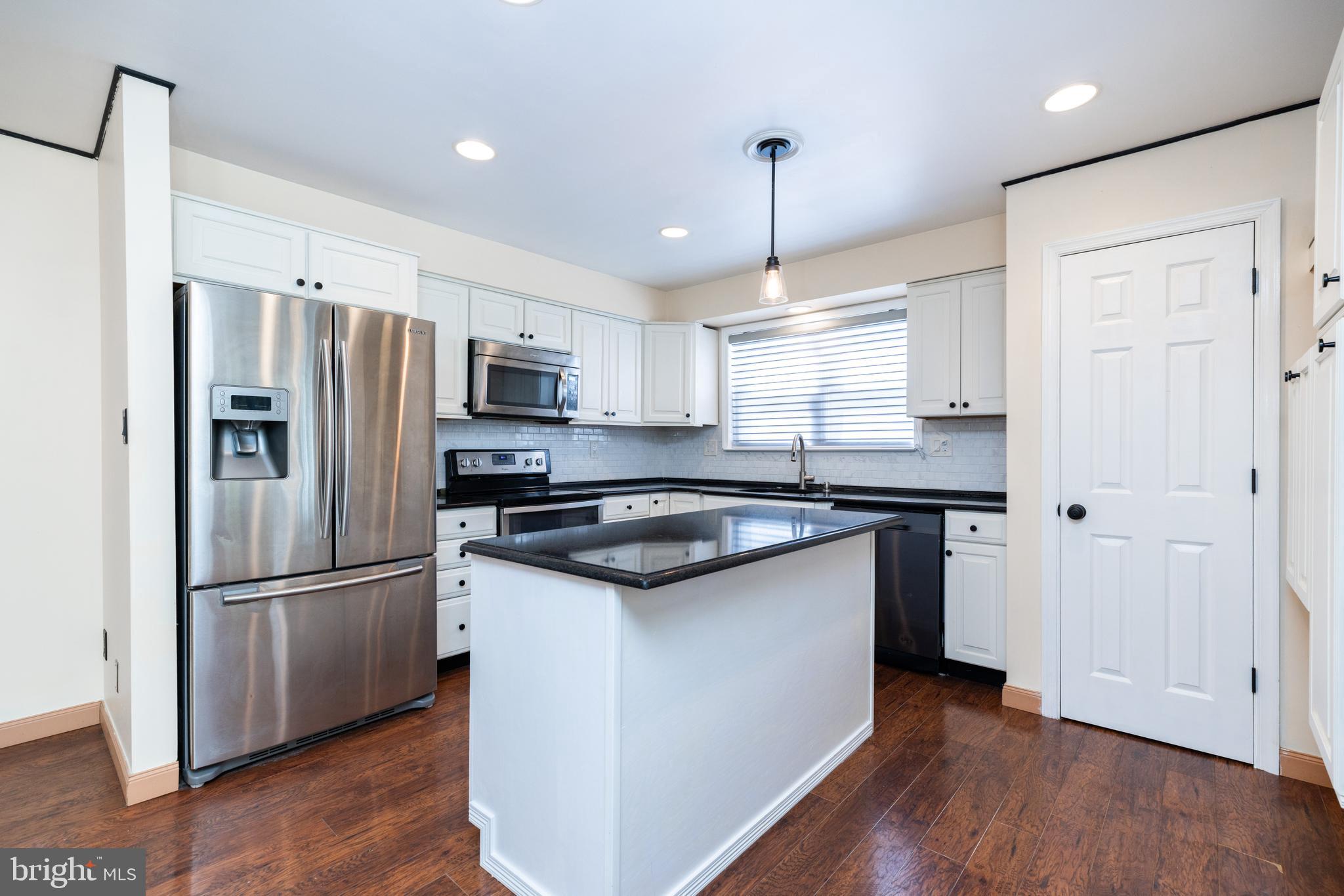 274 Birch Street Newark, DE 19711 - Photo 12 of 41 a kitchen with stainless steel appliances granite countertop a refrigerator a sink dishwasher a stove and a refrigerator