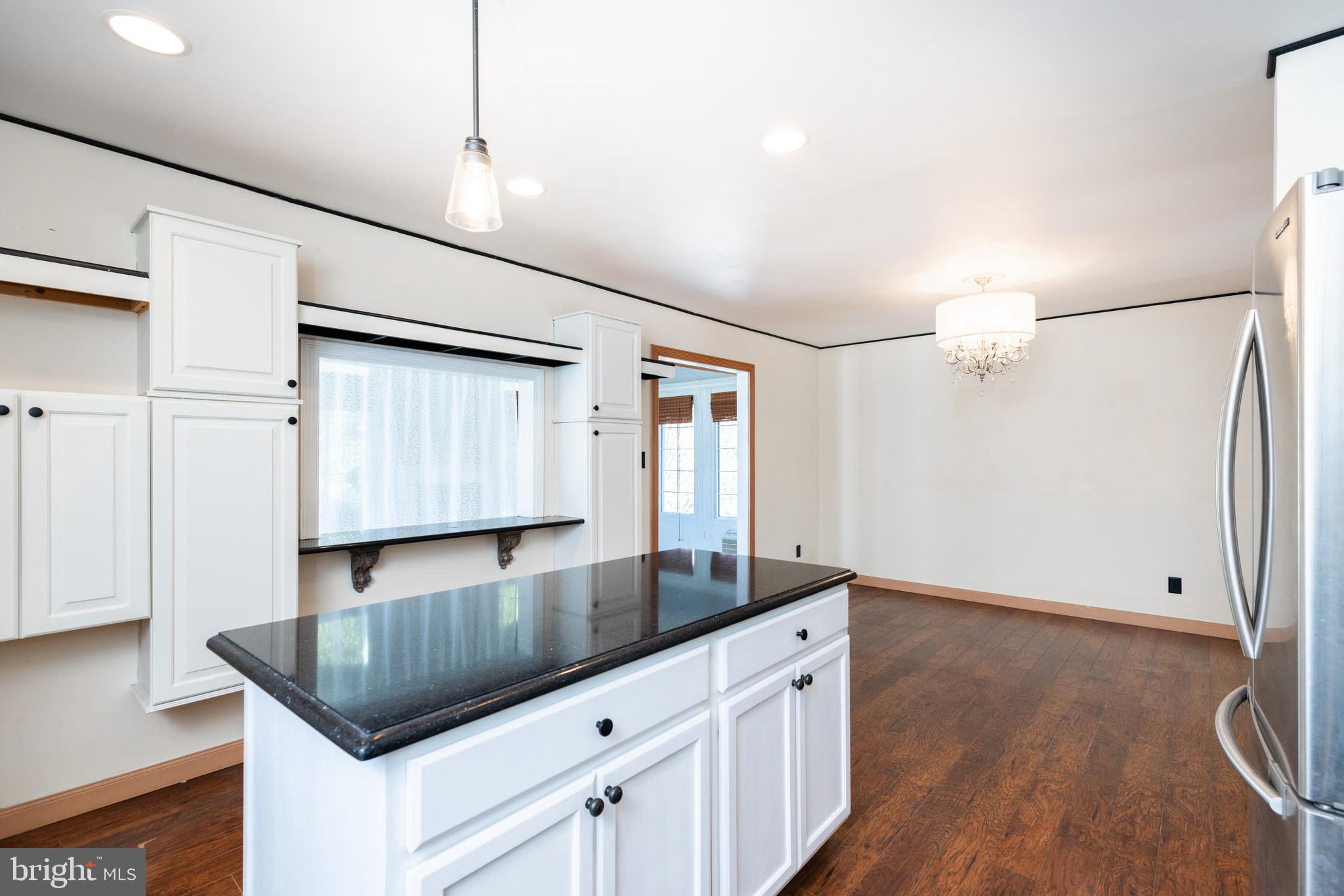 274 Birch Street Newark, DE 19711 - Photo 15 of 41 a kitchen with granite countertop a sink a stove and refrigerator