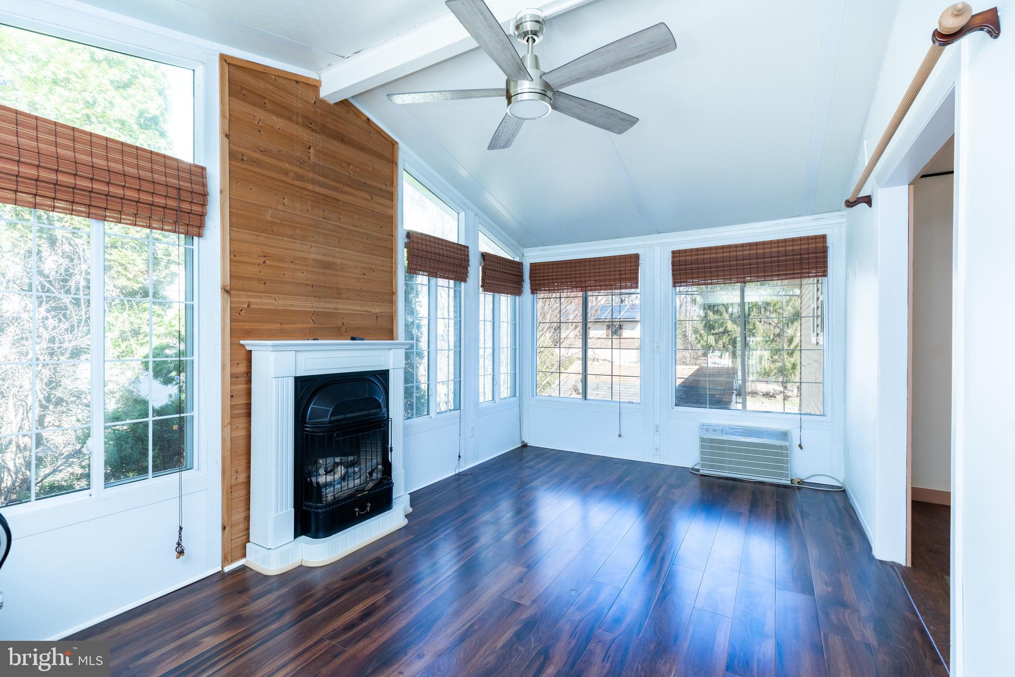 274 Birch Street Newark, DE 19711 - Photo 17 of 41 a view of empty room with wooden floor and fireplace