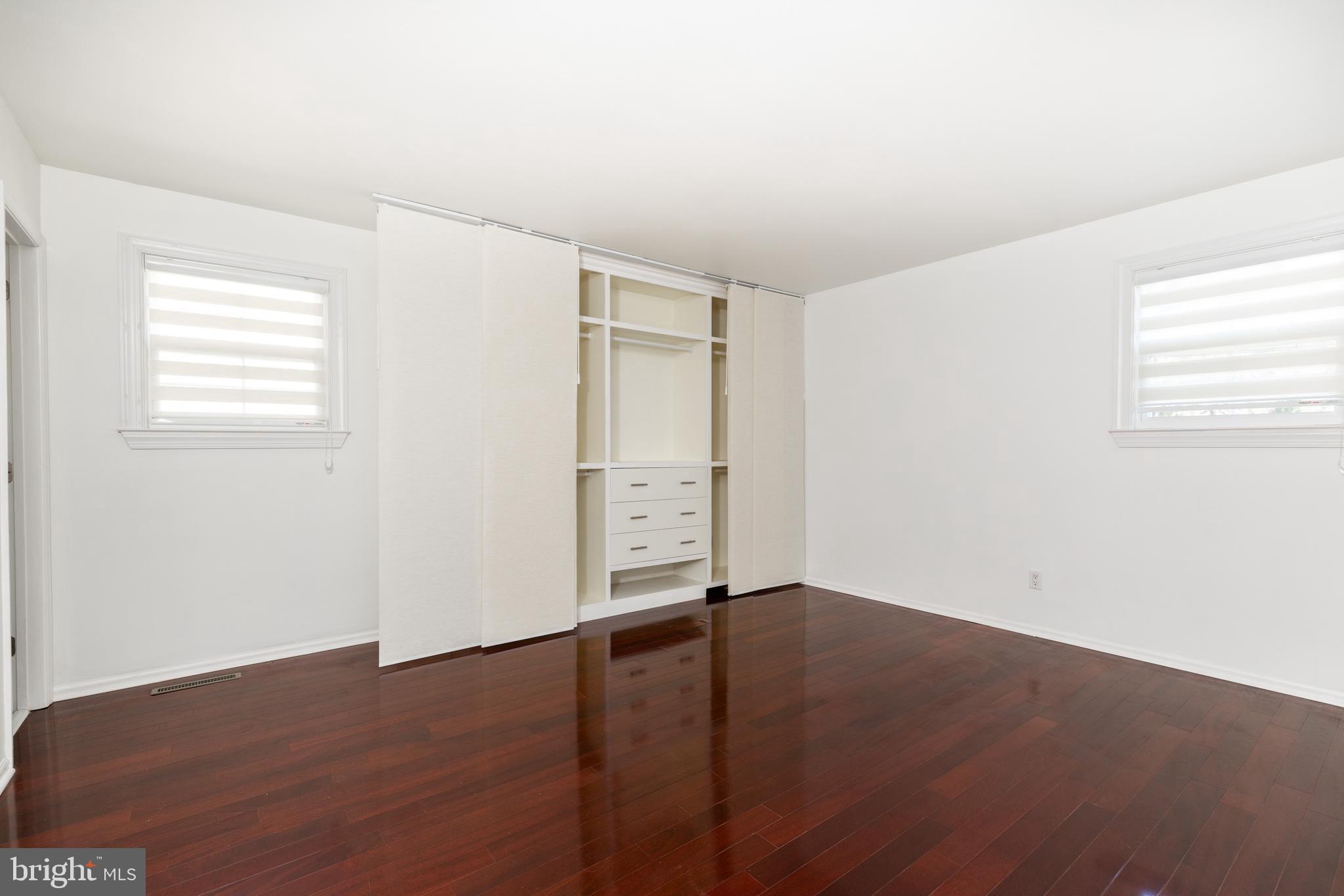 274 Birch Street Newark, DE 19711 - Photo 19 of 41 an empty room with wooden floor and windows