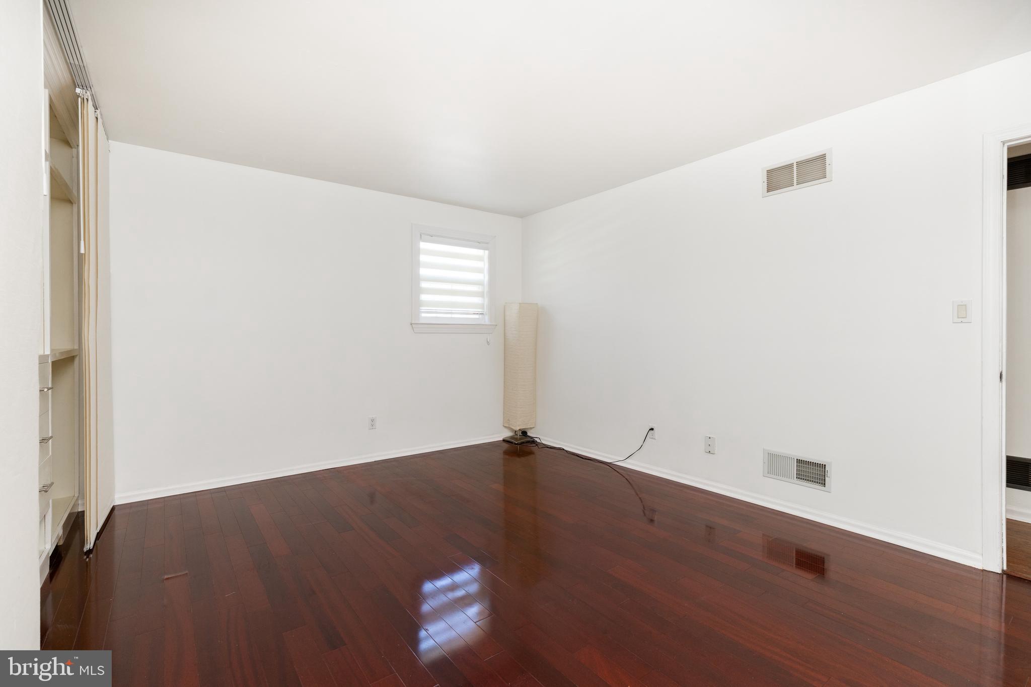 274 Birch Street Newark, DE 19711 - Photo 20 of 41 an empty room with wooden floor and windows