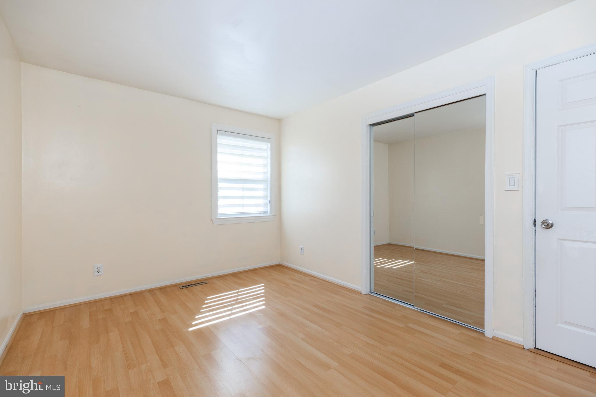 274 Birch Street Newark, DE 19711 - Photo 23 of 41 an empty room with wooden floor and windows