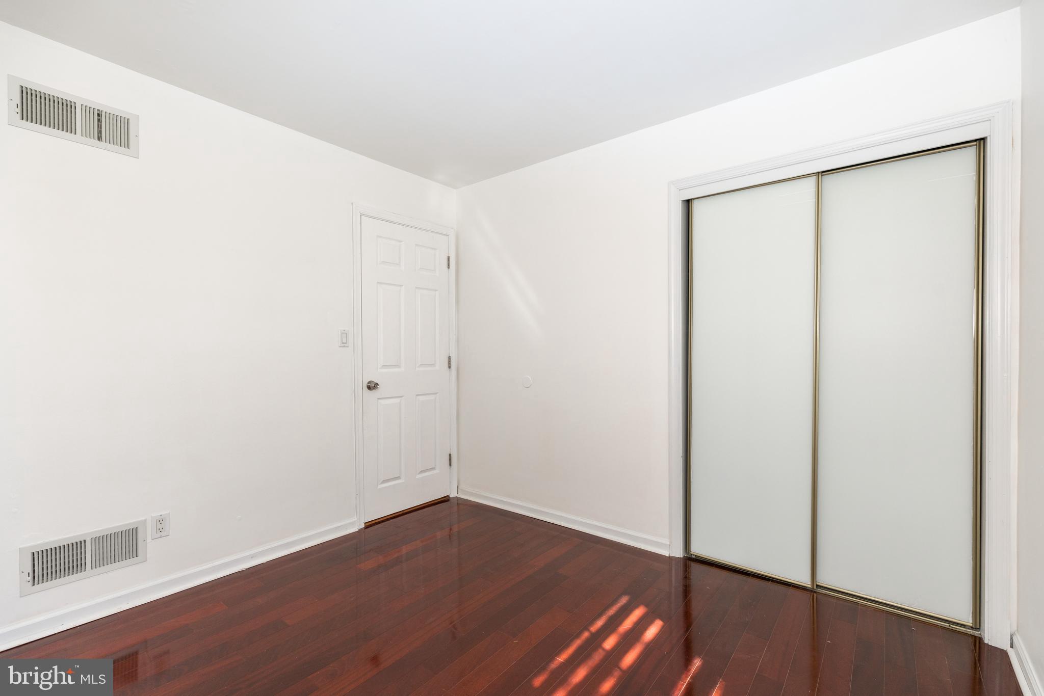 274 Birch Street Newark, DE 19711 - Photo 26 of 41 a view of an empty room with wooden floor