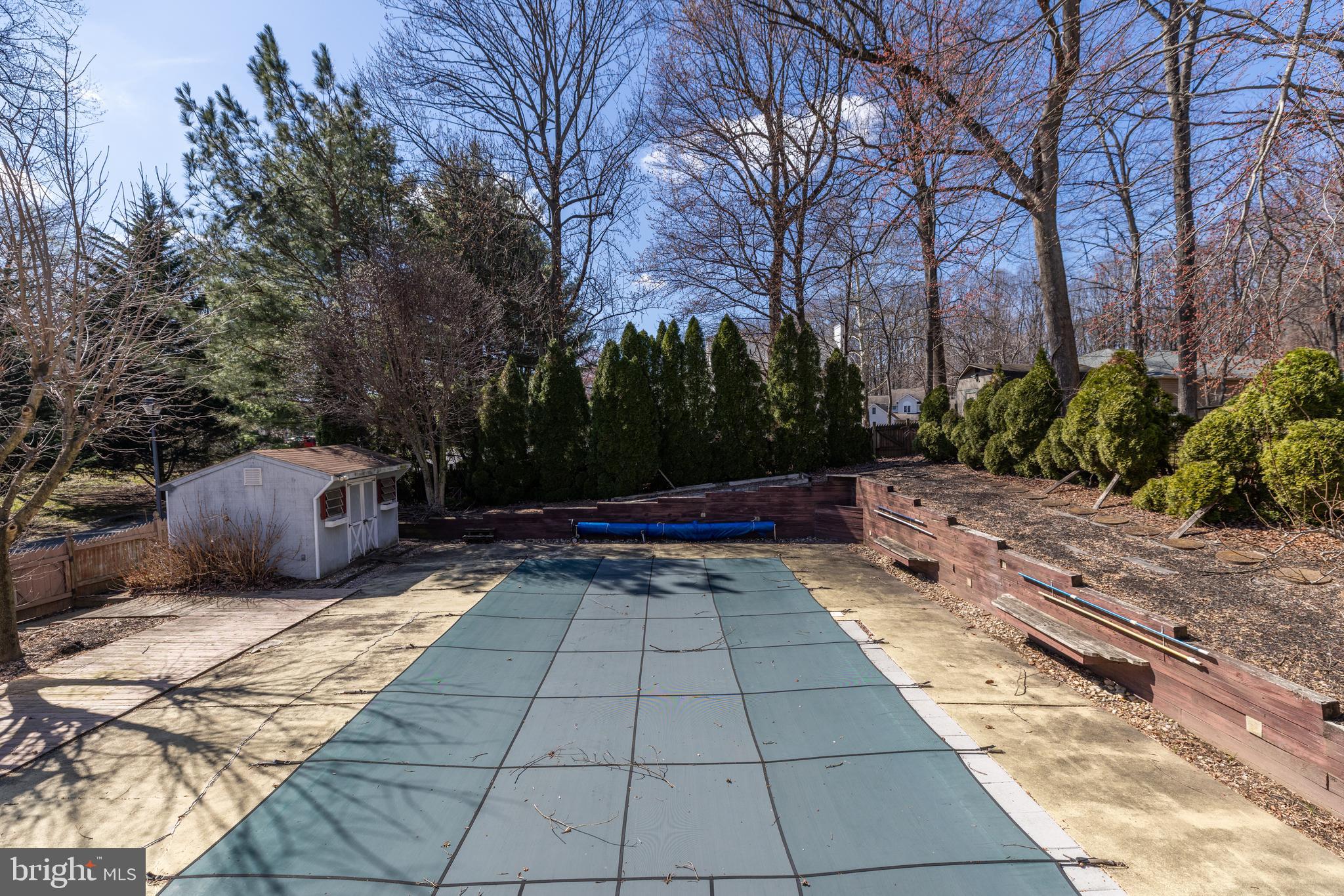 274 Birch Street Newark, DE 19711 - Photo 27 of 41 a view of backyard with table and chairs plants and trees