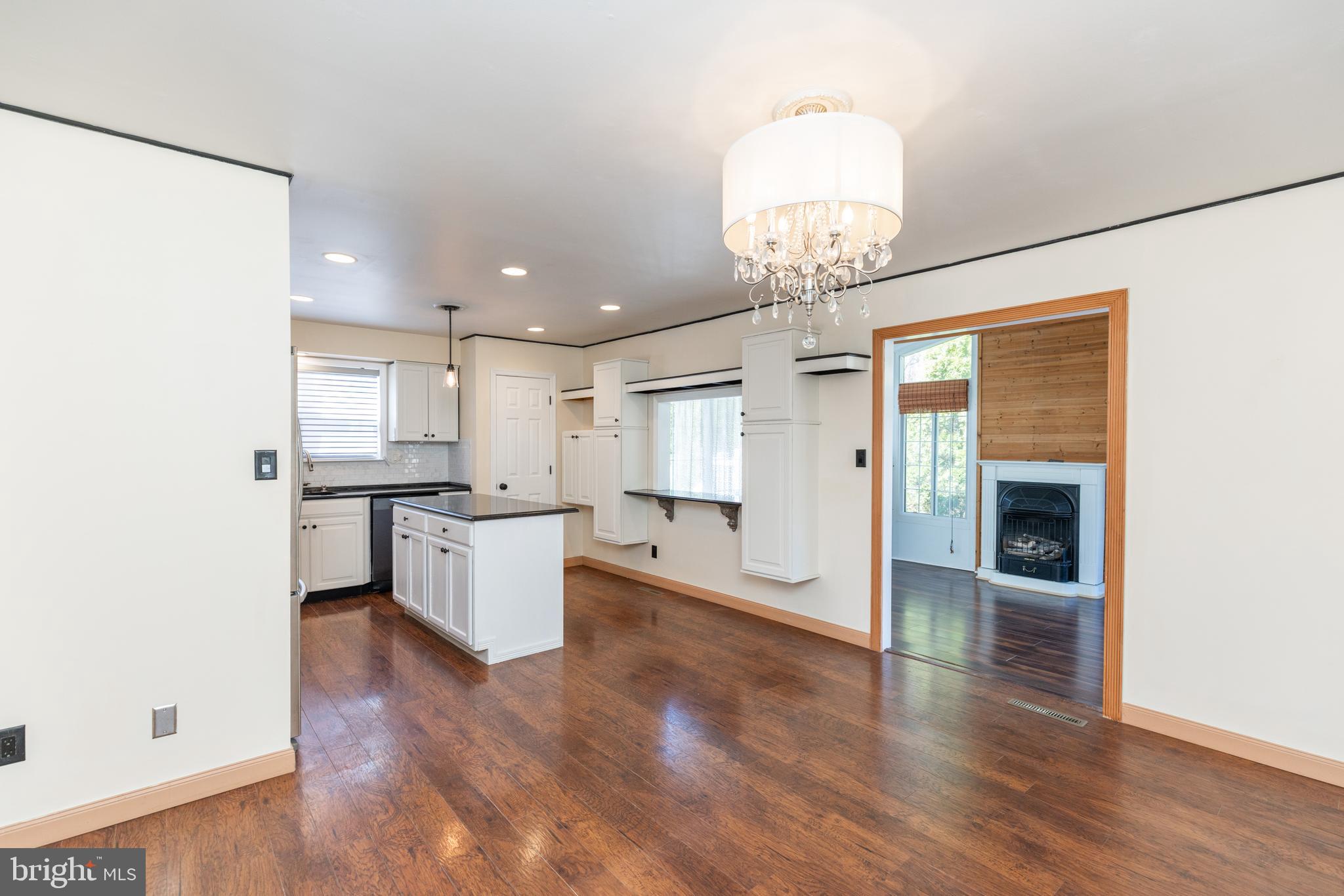 274 Birch Street Newark, DE 19711 - Photo 8 of 41 a view of a kitchen with cabinets stainless steel appliances and wooden floor