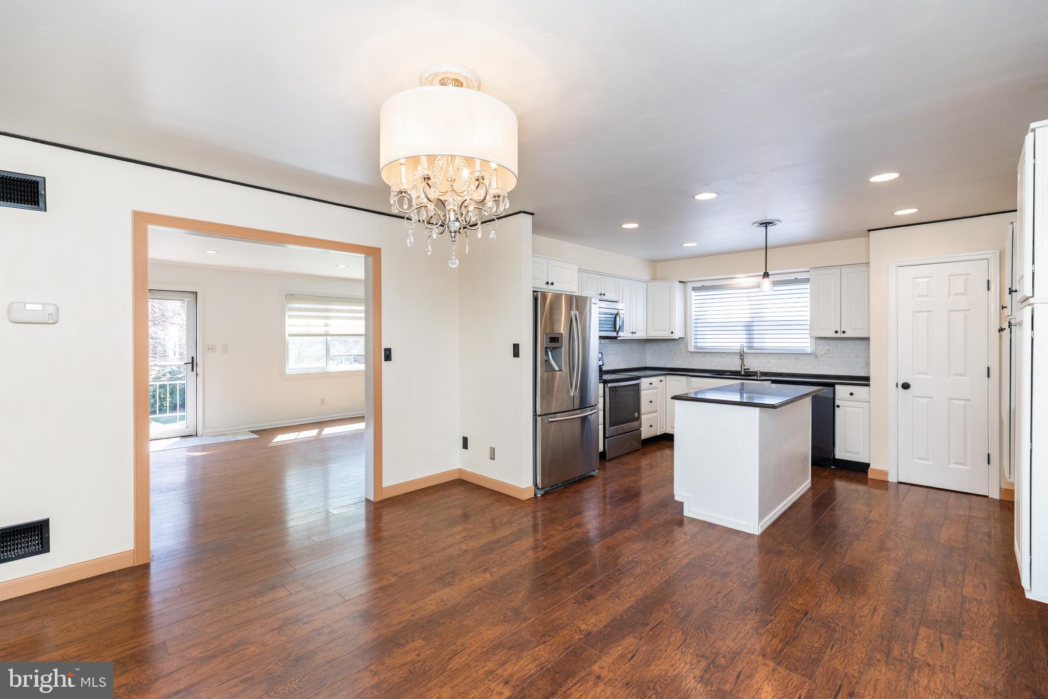 274 Birch Street Newark, DE 19711 - Photo 9 of 41 a view of kitchen with refrigerator and wooden floor