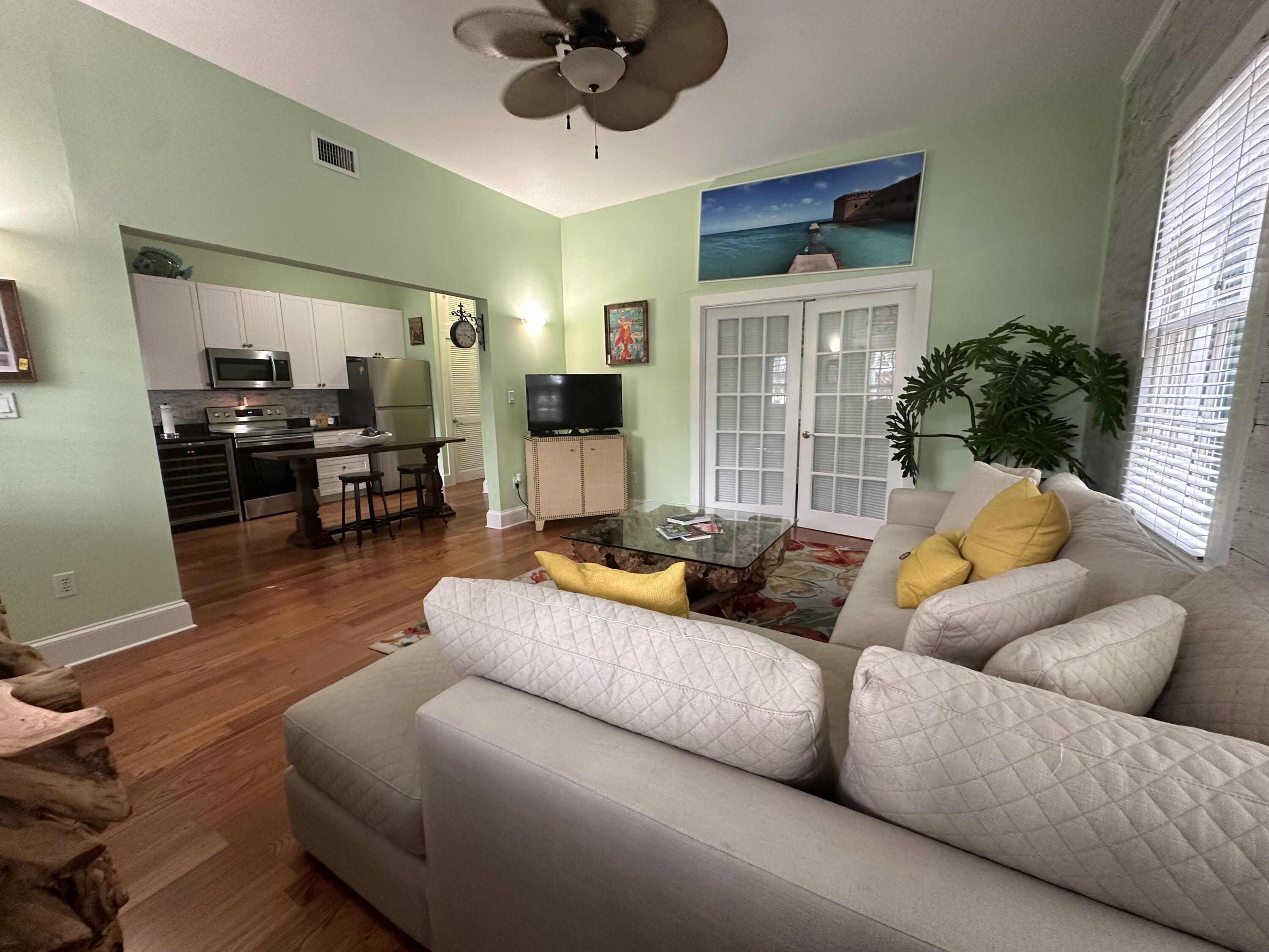 817 Eaton Street, Unit 1 Key West, FL 33040 - Photo 13 of 30 a living room with furniture and a large window