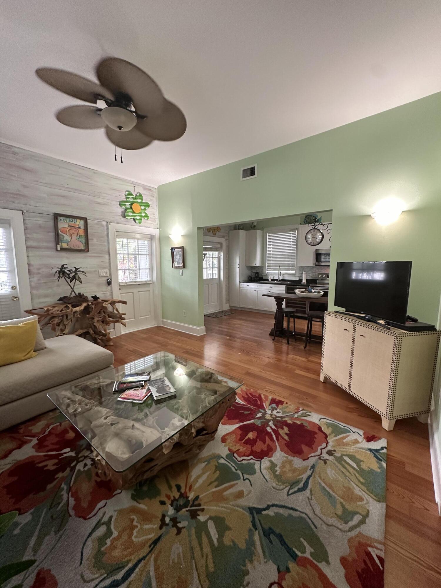 817 Eaton Street, Unit 1 Key West, FL 33040 - Photo 14 of 30 a living room with furniture and a wooden floor